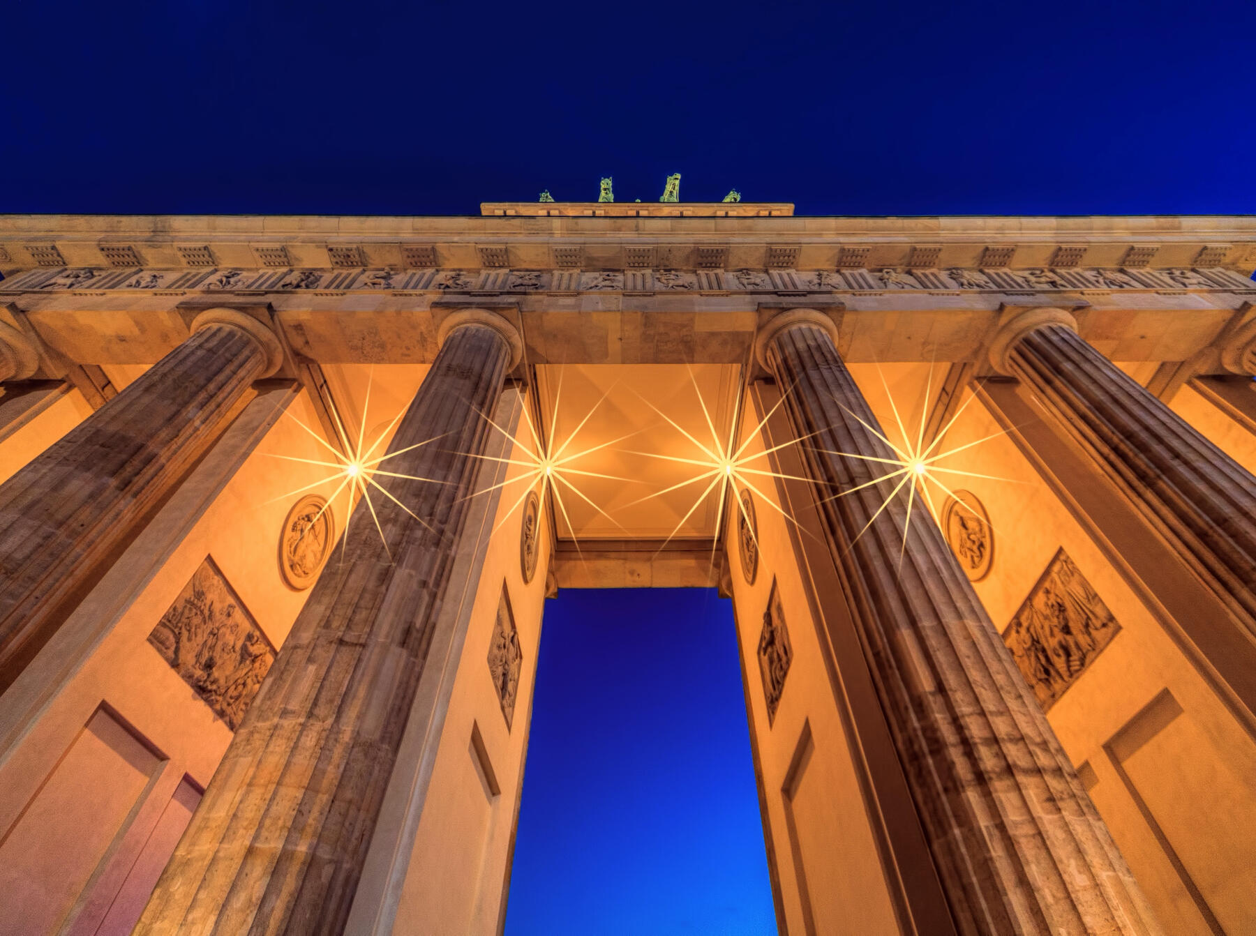 Germany Advertising Agency, A Global Marketer's Guide Brandenburg gate against bright blue evening sky, from advertising in germany agency guide