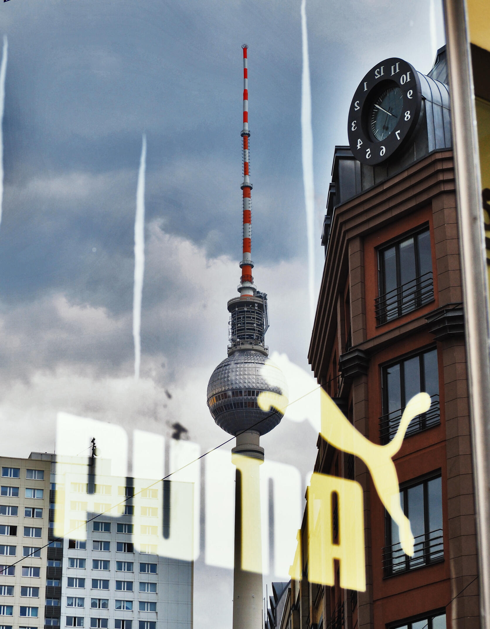 Puma logo against reflection of TV tower Berlin, from page on advertising in germany